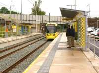 A Metrolink tram calls at Derker on a Rochdale to East Didsbury service on 31 July 2013.<br><br>[John McIntyre 31/07/2013]