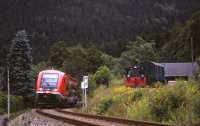 On 29th June 2013, a Schwartzatalbahn branch train for Katzhuette passes the Obstfelderschmiede station chord siding (with diesel shunter and elderly DB wagon) linking to the Oberweissbacher Bergbahn funicular. <br><br>[David Spaven 29/06/2013]