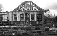 As reported in August 2013 [see news item] the former Dalnaspidal station building, subsequently relocated to Aviemore, is being dismantled once more and moved to the Insider Festival site. The photograph shows the building being re-assembled  at the Strathspey Railway's Speyside station in April 1979 following its move from Dalnaspidal.<br><br>[John McIntyre /04/1979]