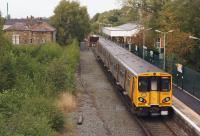 Merseyrail 508137 approaches the buffers as it arrives at Ormskirk on 15 September 2013 with a service from Liverpool. [See image 15790] for a similar view north from Derby Street bridge some 22 years earlier when the vegetation was less prolific.<br><br>[John McIntyre 15/09/2013]