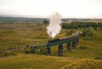 After a stop at Rannoch Station on 22 September, K4 No.61994 <I>The Great Marquess</I> hauls the heavily laden <I>West Highlander Railtour</I> over the viaduct north of the station. The rails are wet and the engine's sanders are working as it blasts its way up the gradient.<br><br>[John Gray 22/09/2013]