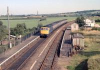 A Waterloo to Barnstaple service arrives at Newton St Cyres in the 1980s.<br><br>[Ian Dinmore //]