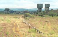 View south over the former Down Yard at Millerhill in 1992 with Monktonhall Colliery in the background.  The Borders Railway will veer to the right here through what is now a forest!<br><br>[Bill Roberton //1992]