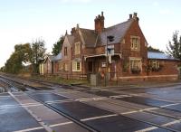 The former Moortown station buildings viewed north over the B1205 level crossing on 9 October 2013. The station opened in 1848 and closed in 1965.<br><br>[John McIntyre 09/10/2013]