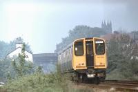 <I>Ormskirk to Glasgow?</I> EMU 507022 approaches Ormskirk from Liverpool in 1980. This set was subsequently disbanded (around 1995 following an accident at Kirkdale) and one of the driving cars now operates out of Glasgow Central in EMU 314203 replacing the coach damaged in the Newton collision [see image 22690]. Replacement of the Merseyrail Class 507s and 508s is now being put out to the train builders but in 2013, livery apart, this scene is unchanged from thirty three years earlier. <br><br>[Mark Bartlett //1980]