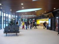 Looking along the concourse of the newly opened Wakefield Westgate station up side main building, with retail units and the brightly lit platform entrance on the right. The ticket office is at the far end of the concourse.<br><br>[David Pesterfield 24/12/2013]