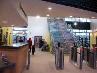 Looking from the concourse to the platform 1 access doors and footbridge steps at the newly opened Wakefield Westgate station up side main building on Christmas Eve 2013.<br><br>[David Pesterfield 24/12/2013]