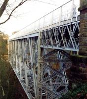 A notable early example of steel box lattice girder construction, is the 1892 Bilston Glen viaduct on the former Glencorse branch. The viaduct, with its impressive 135m span, is seen here looking north towards Loanhead in 2003. The structure was restored during the 1990s. <br><br>[John Furnevel 25/10/2003]
