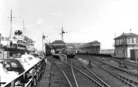 A DMU from Glasgow stands at Stranraer Harbour station on 5 August 1962. Berthed on the left is <I>Caledonian Princess</I>, recently arrived from Larne. <br><br>[David Stewart 05/08/1962]