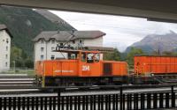 Grab shot of the resident metre gauge <I>steeple cab</I> shunter at Samedan where the lines from Chur, Scuol, St. Moritz and Tirano meet. RhB 214 is one of two built for the railway in 1984 with three powered axles working from the 11kv overhead system. <br><br>[Mark Bartlett 16/09/2013]