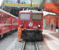 Manoeuvres at Chur, the junction where the eastbound <I>Glacier Express</I> is divided into two portions for Davos and St Moritz.  This was taken through the corridor connection of the Davos portion as it was shunted towards Rhaetian Ge 4/4 1 loco 605 <I>Silvretta</I>. This venerable machine, dating from 1953, is one of only four survivors of a class of 10 1588hp locos.  <br><br>[Mark Bartlett 14/09/2013]