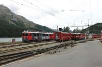 Although St. Moritz is a terminus (of three main lines) all platforms are through roads with stabling sidings beyond. A lineup of Rhaetian metre gauge rolling stock and motive power is stabled alongside the lake in September 2013. <br><br>[Mark Bartlett 16/09/2013]