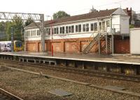 At the south end of Stockport station stands the No.1 Signalbox. Scene in October 2013 with a Northern Class 323 EMU arriving on the left.<br><br>[John McIntyre 03/10/2013]