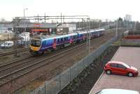 The 11.09 Glasgow Central - Manchester Airport approaching Motherwell on 30 January 2014 after clearing Logans Road level crossing. The train will run non-stop through Motherwell station, its first call being Lockerbie.<br><br>[John Furnevel 30/01/2014]