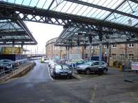 View from the Neville Street entrance of the car park occupying the former goods depot alongside Newcastle Central station, looking along the former bay platforms towards the King Edward Bridge and Forth Banks with a ramp replacing the stop blocks to reach track level.    <br><br>[David Pesterfield 04/02/2014]