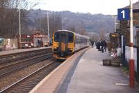 155344 draws to a halt at Todmorden platform 1 on 10 February with a westbound service for Manchester Victoria.<br><br>[John McIntyre 10/02/2014]