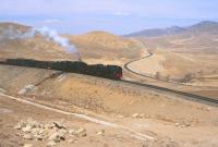 The start of the heavy grades and spiralling lines at Reshui, Inner Monglia, in April 2000. The arrangement enables heavy freights to climb over the Jing Peng mountain range. [See image 20082]<br><br>[Peter Todd 15/04/2000]
