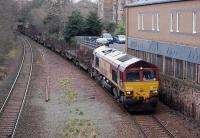 DBS 66115 passes through the site of Newington Station on 18 March with the 6E30 Dalzell - Tees Yard steel empties.<br><br>[Bill Roberton 18/03/2014]