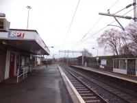 Platform view north east at Cumbernauld on 21 February 2014, with the old footbridge now removed and overhead line equipment installed.<br><br>[Colin Harkins 21/02/2014]