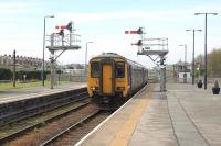 Northern 156479, on a service from Carlisle and Workington, runs past the carriage sidings and signal box and in to Platform 2 at Barrow-in-Furness. The train will continue via Ulverston to eventually terminate in Lancaster.<br><br>[Mark Bartlett 28/04/2014]