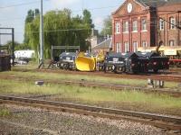 A quartet of propelled snow ploughs in the down side stabling sidings at Doncaster on 21 May 2014. On the far left an East Coast DVT is on the works head-shunt attached to a class 08 shunter.<br><br>[David Pesterfield 21/05/2014]
