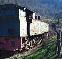 When viewed from the rear, the massive bulk of French built 0-8-0T No. 144R03, seen here dumped at Oskova, Bosnia on 14th March 2014, seems more reminiscent of some Edwardian era British tanks - for example the LSWR 4-8-0Ts of class G16 - and it comes as something of a surprise to find it was built as late as 1954.<br><br>[Bill Jamieson 14/03/2014]