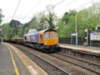 66709 northbound off the curve and through Morpeth station with a ballast train on 23 May 2014.<br><br>[Peter Todd 23/05/2014]