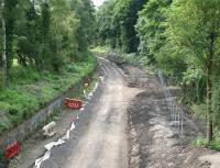 The Waverley trackbed in June 2014 looking south from the A6106 bridge towards Eskbank. [See image 38706]<br><br>[John Furnevel 22/06/2014]