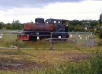 This 1929 Bagnall fireless locomotive was delivered new to Distillers, and later worked at Procter and Gamble. Since 2008, it has resided in a field adjacent to the Nuneaton-Leicester line, by Leicester Road, in Blaby. It was placed there by a local farmer to encourage the powers that be to reopen Blaby station, which closed in 1968. No luck so far.<br><br>[Ken Strachan 28/06/2014]