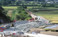 The realignment of the track for the replacement Pont Briwet has (temporarily) obliterated Llandecwyn halt, seen here on 6 July 2014. As the area is part of Snowdonia National park, care is being taken to build the boundary walls with local materials.<br><br>[Colin McDonald 06/07/2014]