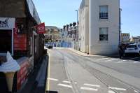 View along Custom House Quay, Weymouth, showing part of the line running through the streets to the south of the current Weymouth terminus to reach Weymouth Quay. Still in situ on 17 July 2014 but not in use. [See image 44106]<br><br>[Peter Todd 17/07/2014]
