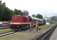 By sheer coincidence (honestly!) the photographer found that his holiday in Putbus on the island of Ruegen concided with the 14th and 15th June annual Putbus Railfest. On 14th June, ex Deutsche Reichsbahn (DR) Class 112 diesel and Class 52 steam locos prepare to operate the first Plandampf train of the day to Bergen auf Ruegen, substituting for the normal diesel unit service. The Plandampf is a common sight in Germany, with heritage locomotives taking over normal timetabled services - a lesson perhaps for the Borders Railway?<br><br>[David Spaven 14/06/2014]
