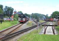At 12.40 on 14th June the 06.00 charter from Leipzig and Berlin arrives at Putbus in the middle of the annual Railfest - the train is topped by ex-DR 01 0509-8 and tailed by ex-DR diesel 118 770-7. Note standard and narrow-gauge tracks merging in the foreground for the 5.8km dual-gauge final section of the Lauterbach Mole branch. The cost of a return ticket from Leipzig was just 89 Euros (about 75) for a round trip of around 600 miles.<br><br>[David Spaven 14/06/2014]