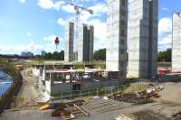 View west from Benalder Street over the site of Partick Central on 7 August 2014, with the River Kelvin on the left. Lift and stair towers are now in place for the new flats. [See image 46940]<br><br>[Colin Miller 07/08/2014]