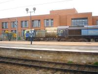 DRS 66431 stabled alongside a Network Rail MPV on 11 March 2014 in sidings by the new Area Operating Centre at the west end of York Station. <br><br>[David Pesterfield 11/03/2014]