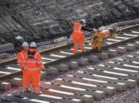 Rail clips being applied to newly laid track at Shawfair on 7 October 2014.<br><br>[Bill Roberton 07/10/2014]