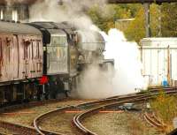 Preserved Jubilee 4-6-0 no 45690 <I>Leander</I> takes the Hellifield line as it sets off past Carnforth Station Junction signal box on 16 October 2014 during a test run.<br><br>[John McIntyre 16/10/2014]