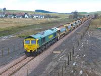 A Borders Railway ballast train photographed on 25 November looking north towards Heriot village. Freightliner locomotives 66605 and 66610 (nearest) are involved.<br><br>[Bill Roberton 25/11/2014]