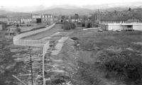 Looking north-west from Duchlage Road over the site of Crieff station to King Street in March 1970. The bridge indicates where the line continued west to Comrie. [See image 27574]<br><br>[Bill Jamieson 17/03/1970]