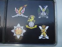 Various regimental crests adorning East Coast Railways 91111 <I>'For The Fallen'</I>, photographed at Newcastle Central on 3 December 2014.<br><br>[David Pesterfield 03/12/2014]