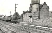 V3 2-6-2T 67646 is about to pass the <i>'Yoker Castle'</i> sewage facility shortly after leaving Yoker station in September 1958 with a Helensburgh - Bridgeton train.<br><br>[G H Robin collection by courtesy of the Mitchell Library, Glasgow 04/09/1958]