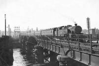 Scene at Strathclyde Junction on 17 May 1957 as Fairburn 2-6-4 tank 42164 brings a train of empty stock north across the river. <br><br>[G H Robin collection by courtesy of the Mitchell Library, Glasgow 17/05/1957]