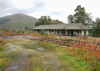 Looking south-west from the former entrance to the yard at Bridge of Orchy in September 2005 with the station in the background at a lower level.<br><br>[John Furnevel 24/09/2005]