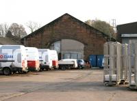 The only surviving building of what was a large Caledonian goods depot to the east of the current Dumfries station. This former goods shed, seen here in November 2005 being used by a firm of heating engineers, is hidden away in what is now St Mary's Industrial Estate.<br><br>[John Furnevel 10/11/2005]