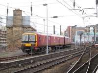 Royal Mail EMU 325015 runs to the stop block on the stabling siding at the west end of Newcastle Central station shortly after mid-day on 13 January 2015.<br><br>[David Pesterfield 13/01/2015]
