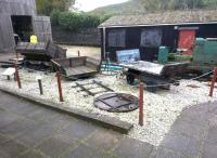 A fascinating collection of narrow gauge items at this clay mining museum near St Austell in 2014. There is even a solid tyred lorry - about 100 years old - in the shed in the background. Note the wagon turntable.<br><br>[Ken Strachan 28/11/2014]