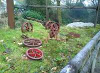 Oh dear, the rats have been at the timbers again. A collection of wheels for narrow gauge wagons [see image 50104] displayed informally at Wheal Martyn Museum. The timber structure in the background is a leat feeding an overshot water wheel, out of picture to the right.<br><br>[Ken Strachan 28/11/2014]