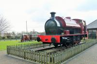 This Hudswell Clarke 0-6-0ST (1885/1955) has been cosmetically restored and is displayed at the entrance to the caravan site that is built on the Knott End line trackbed in Pilling. The loco has been named <I>Pilling Pig</I>, an unofficial name for all trains on the railway which originated with the 1875 loco <I>Farmer's Friend</I> which had a particularly squealing whistle. The number 11302 was actually carried by Manning Wardle 0-6-0ST <I>Knott End</I>, built in 1908 and scrapped by the LMS in 1925. <I>The Pilling Piglet</I> behind may be a representation of the ex-LNWR Railmotors that plied the line from 1923 to 1930. <br><br>[Mark Bartlett 29/01/2015]