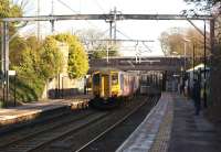 A Liverpool to Blackpool service runs non-stop through Thatto Heath station on 3 February 2015. Electrification is well advanced but there is a big push now on with full line possessions on Sundays until mid March in an attempt to recover from earlier delays.<br><br>[John McIntyre 03/02/2015]