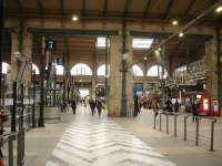 Looking west to east along the lengthy concourse at Gare du Nord in February 2015. Platforms are numbered 2 to 19, with platforms 2 to 5 for Eurostar services only. The concourse for the easternmost platforms is beyond the main building and is enclosed in a modern glass structure [See image 50643]. <br><br>[David Pesterfield 26/02/2015]